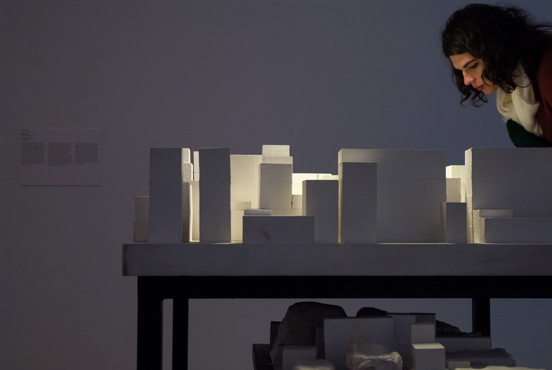 table, spain, wall - building feature, macba, gallery, adult, three quarter length, one person, wood, near, indoors, building, installation, hairstyle