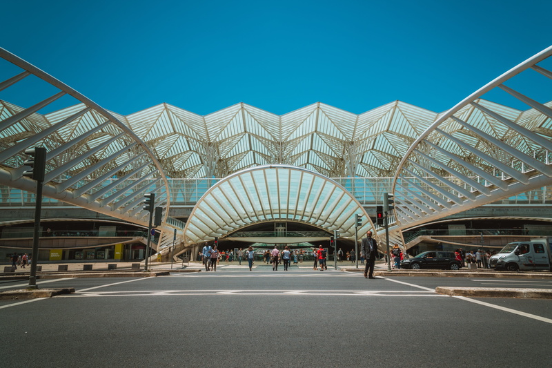facade, perspective, tourism, urban, symbol, nature, transportation, railway station, sky, 5K, group of people, blue, structure, business, road, building exterior