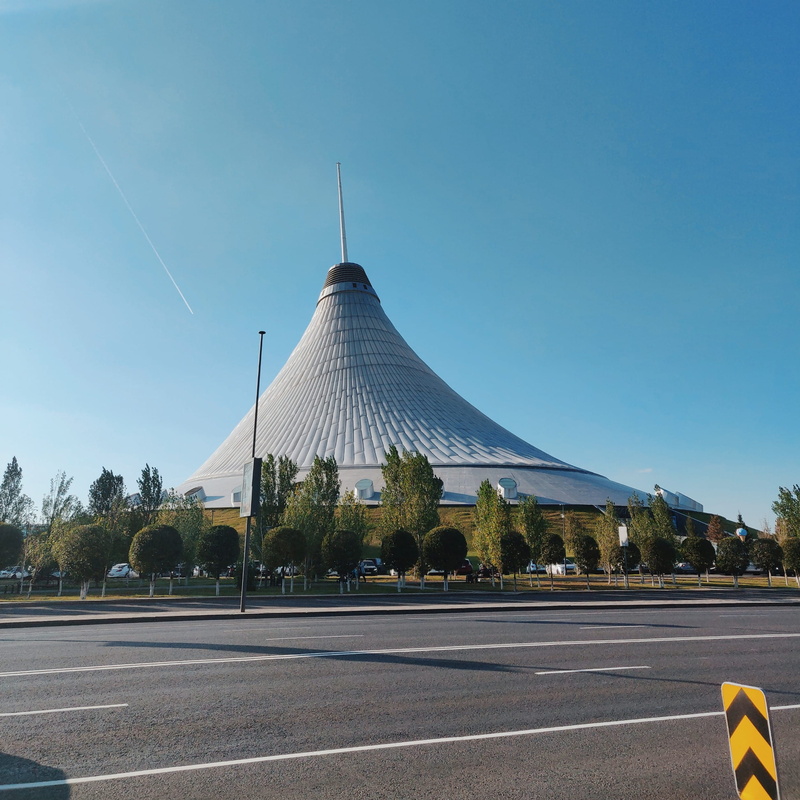 travel destinations, steeple, day, sign, gray, road, highway, building exterior, no people, kazakhstan, transportation, blue, dome, shape, tarmac, cone