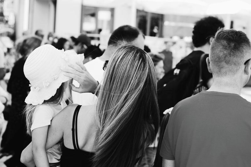 leisure activity, incidental people, man, waist up, group of people, mother, hair, dad, casual clothing, parents, human hair, adult, standing, carrying