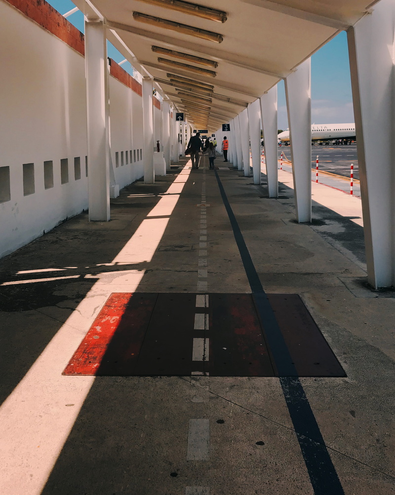 real people, leading lines, walkway, girl, 2K, flooring, ceiling, traveling, yellows, daughter, shadow, holding hands, sign, nature, dad, travel, incidental people