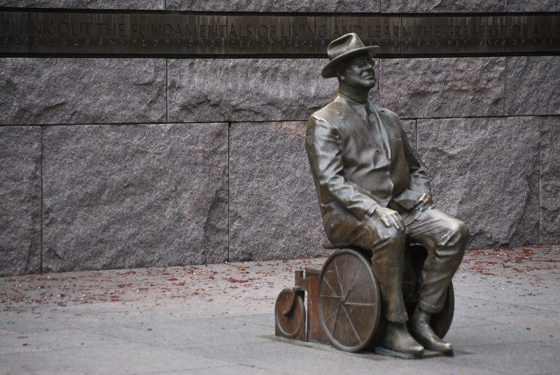 day, sitting, architecture, headwear, full length, human representation, sidewalk, protection, handicap, concrete, wall - building feature, work helmet