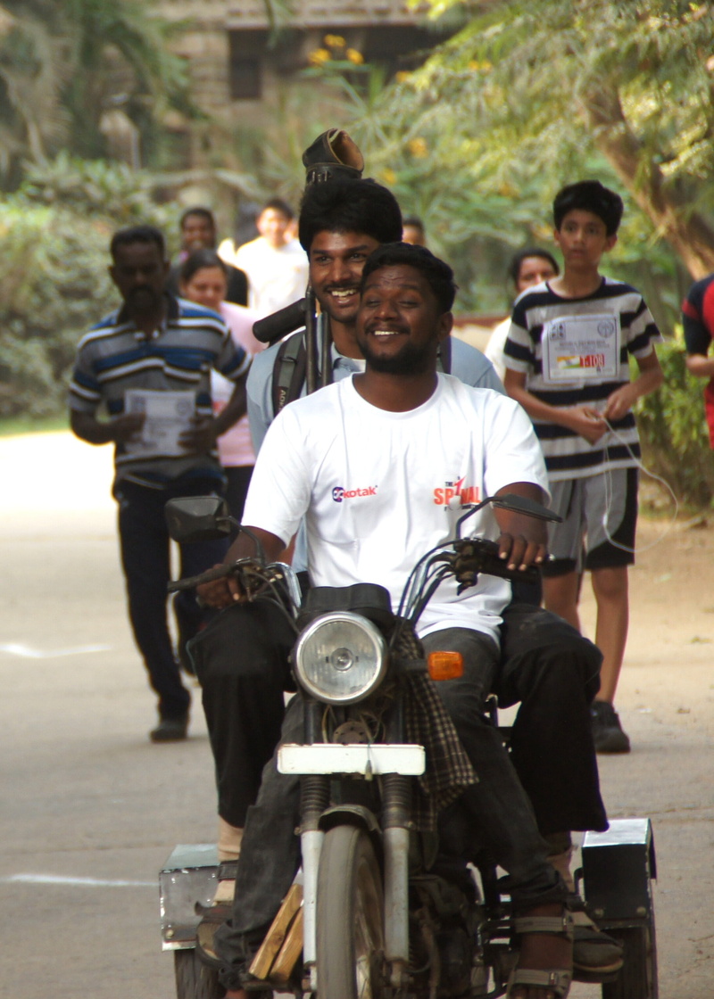 mode of transportation, incidental people, motorcycle, people, full length, crutches, smiling, race, uniform, bike, motorbike, land vehicle, friends, two-wheeler