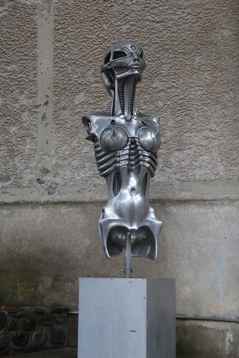 male likeness, wall - building feature, human representation, built structure, alien, architecture, sculpture, craft, statue, building, museum, art and craft