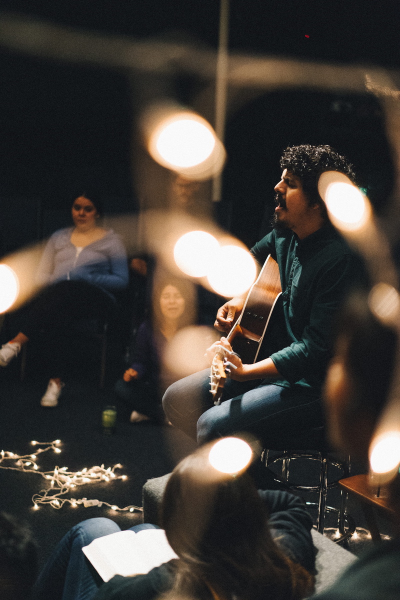 god, three quarter length, sitting, night, men, two people, prayers, lights, united states, indoors, adult, sings, christmaslights, artist, lifestyles