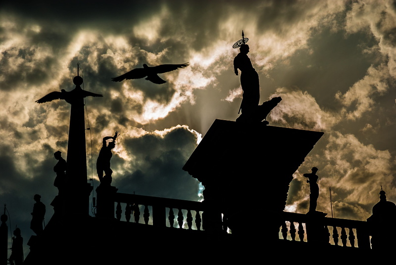 Sky, animal wildlife, built structure, human representation, male likeness, heat, view, Venice, architecture, blue, christianity, sculpture, sunset, nature