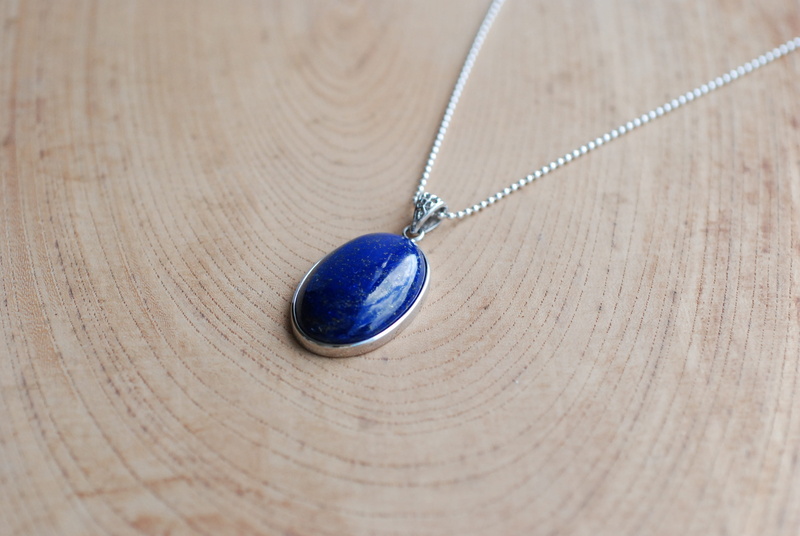 table, lapis lazuli, metal, no people, art and craft, pendant, wood - material, 4K, accessories, chain, still life, close-up, wood grain, luxury, ornate