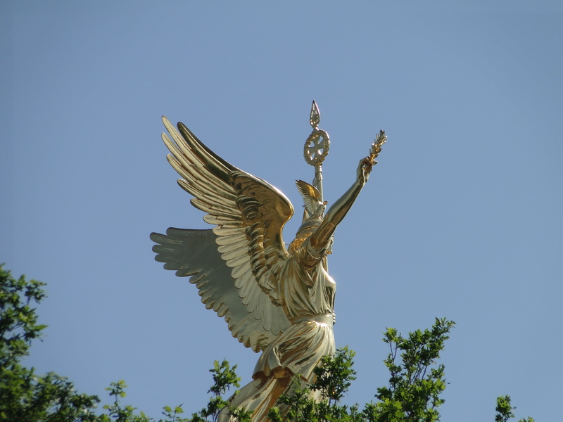 monument, spread wings, eagle, human representation, sunny, historic, bird, tourism, tree, berlin, europe, vertebrate, symbol, outdoors, sculpture, low angle view