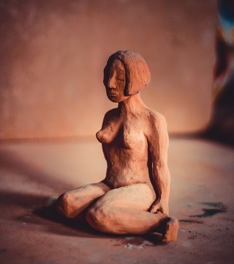 close-up, form, 2K, clay figure, indoors, single object, hands, focus on foreground, art class, human representation, potters, temple - Building, buddhism