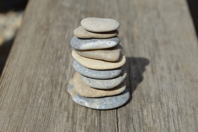 focus on foreground, natural stone, rocks, pebble, group of objects, medium group of objects, stack, stacked, group, stack rock, table, pebbles, outdoors