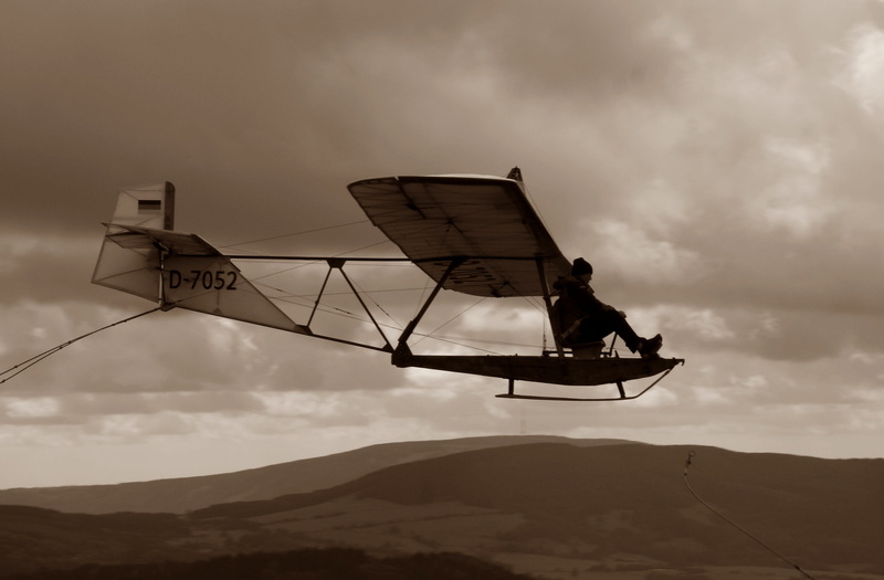 communication, men, air Vehicle, fly, leisure activity, full length, outdoors, 2K, black-and-white, mid-air, sepia, one person, clouds, school gliders