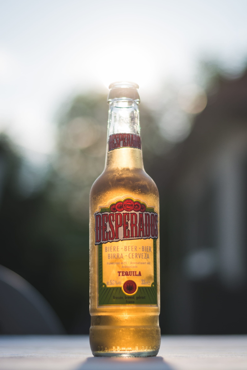 single object, tequila, desperados, refreshment, nature, outdoors, drink, close-up, text, container, beer, bottle, focus, alcohol, sunlight, selective