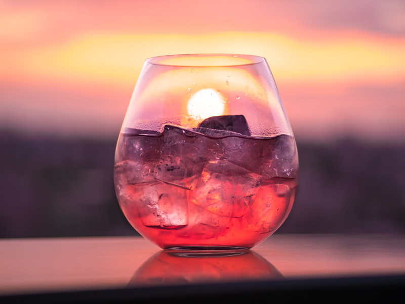 single object, ice cube, drinking glass, glass, refreshment, close-up, household equipment, drink, brown, alcohol, transparent, cold temperature, surface