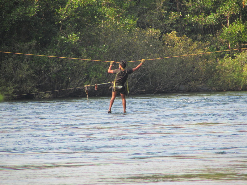 rear view, leisure activity, tree, wild, lifestyles, shirtless, human arm, environment, adult, waterfront, crossing, outdoors, Kali River, casual clothing