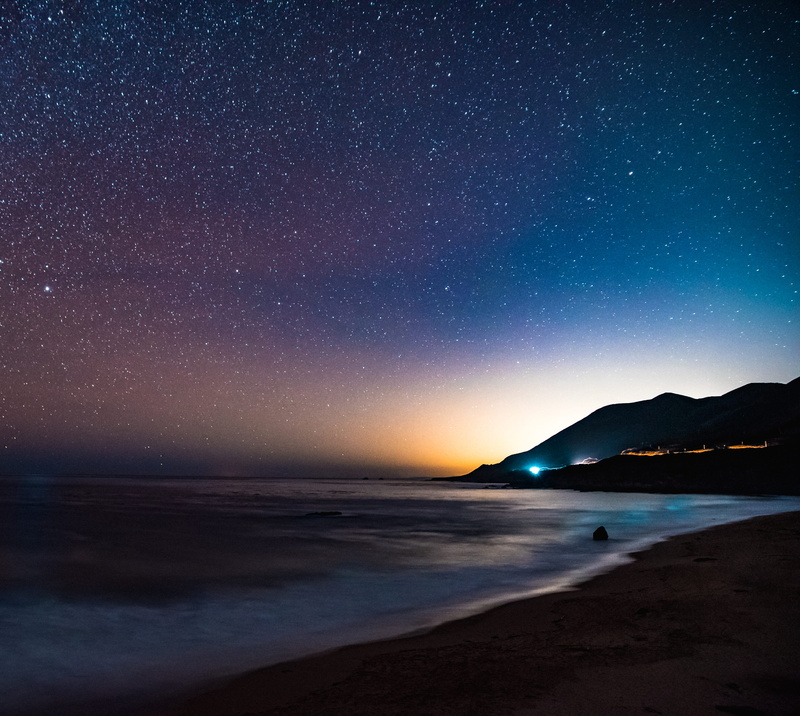 scenics - nature, beside, nighttime, stars, water, nature, 4K, astronomy, land, dark, beach, mountain, near, star field, coastline, body, outdoors, sky