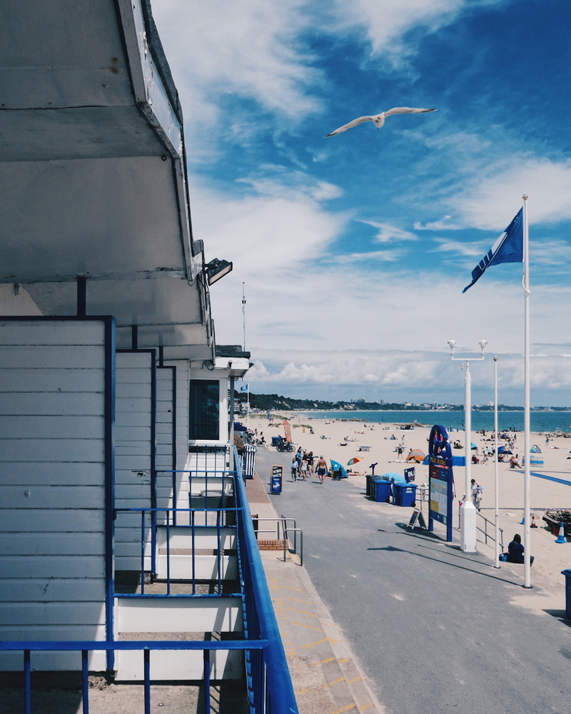 built structure, sailboat, day, flight, beach, nautical vessel, cloud - sky, nature, direction, seaside, poole, mode of transportation, boat, hut, promenade