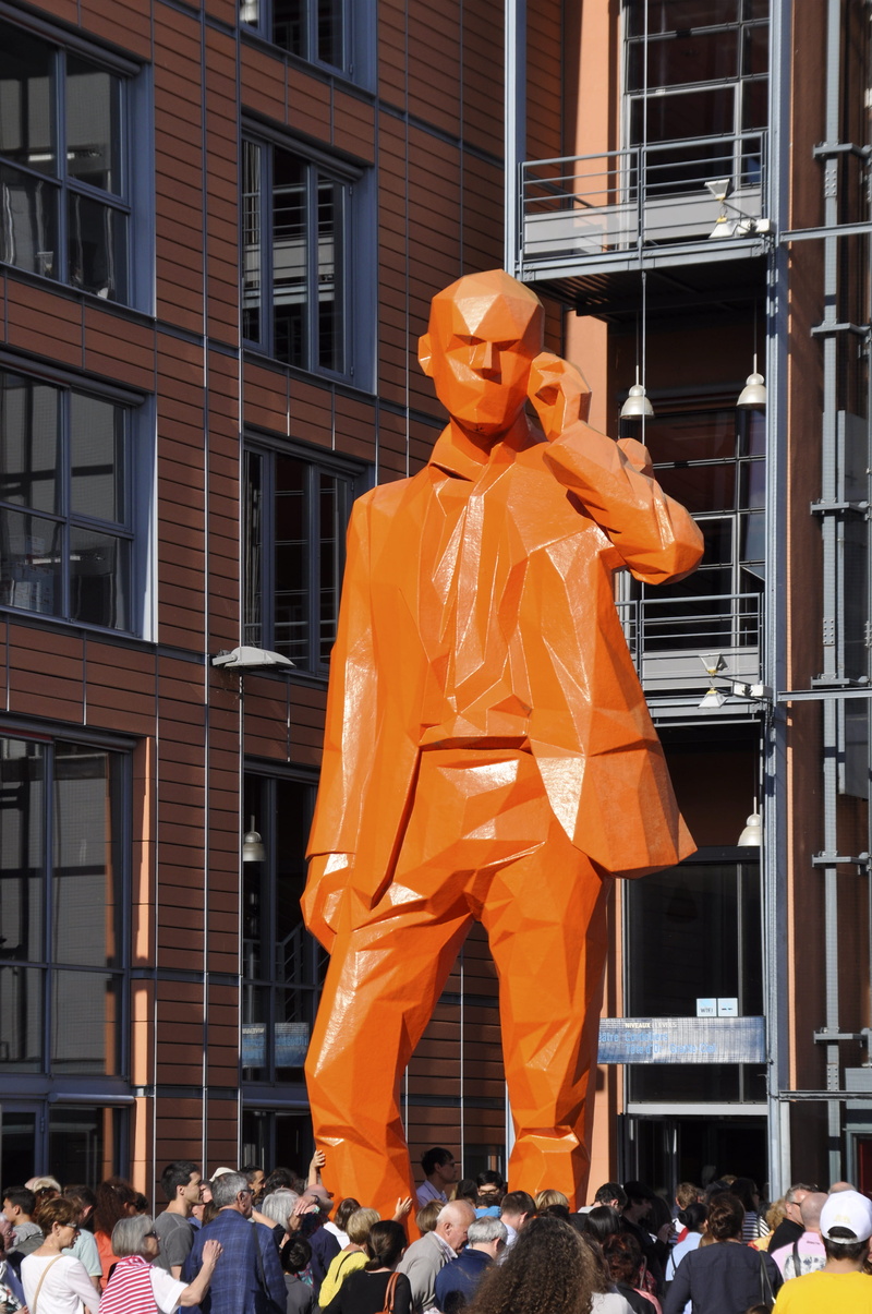 adult, real people, city, large group of people, 4K, crowd, outdoors, building, built structure, representation, orange color, day, spectator, goliath