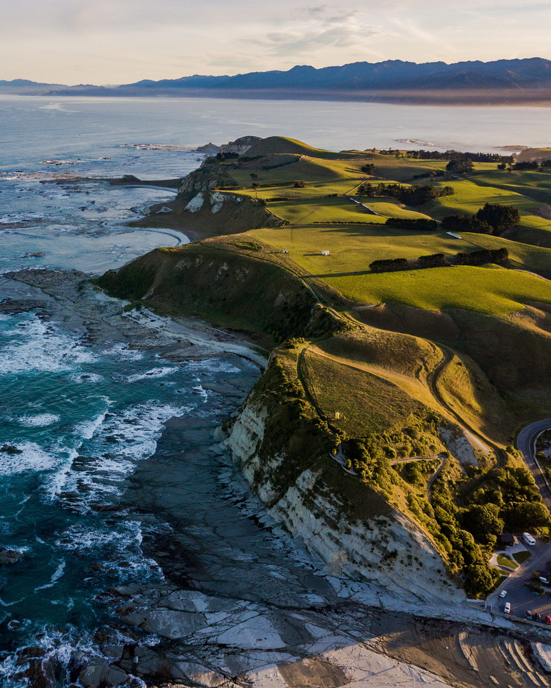 promontory, body, environment, walkway, sea, peninsula, beach, field, leisure activities, tranquil scene, 2K, cliff, nature, shoreline, near, sunset, non-urban scene