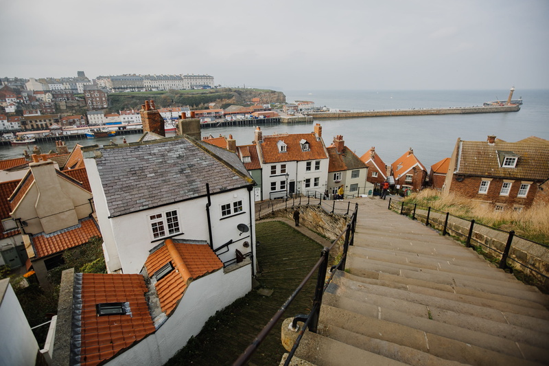 sky, daytime, human, roof tile, near, coast, house, architecture, person, 199 steps, nature, whitby, roof, transportation, outdoors, building exterior