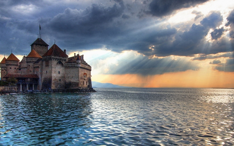 built structure, the past, no people, sea, twilight, history, beauty in nature, castle chillon castle switzerland lake geneva, outdoors, water, dramatic sky