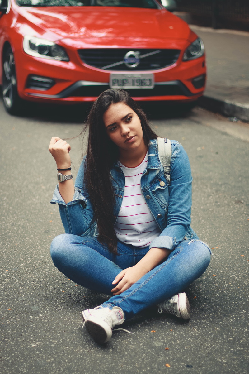 clothing, red, front view, full length, hairstyle, crash helmet, road, volvo, young women, 4K, denim, hair, car, woman, city, hardhat, curb, casual clothing