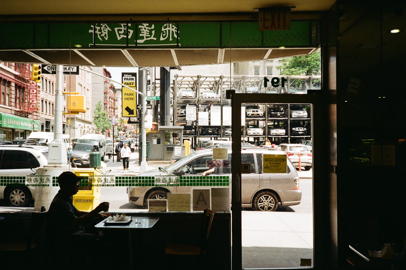city, non-western script, food, outdoors, built structure, silver, people, urban, communication, car, retail, transportation, sitting, store, near, urban Scene