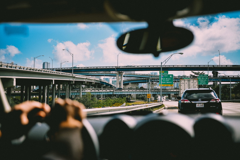 on the move, architecture, wheel, 5K, way, sitting, sky, city, connection, bridge - man made structure, vehicle, outdoors, city life, dashboard, daytime