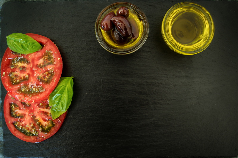 indoors, freshness, olive oil, mediterranean, food, refreshment, basil, green color, kitchen, directly above, leaf, table, vegetable, food and drink, olives