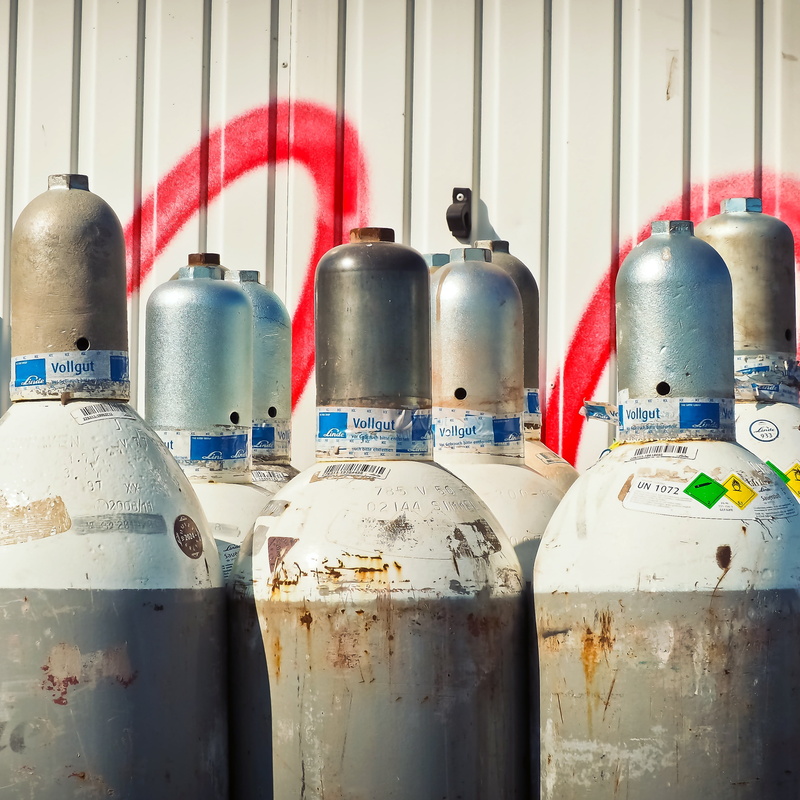 old, wall - building feature, storage tank, choice, still life, red, day, bottle, indoors, group of objects, gray, welder work, explosion danger, container