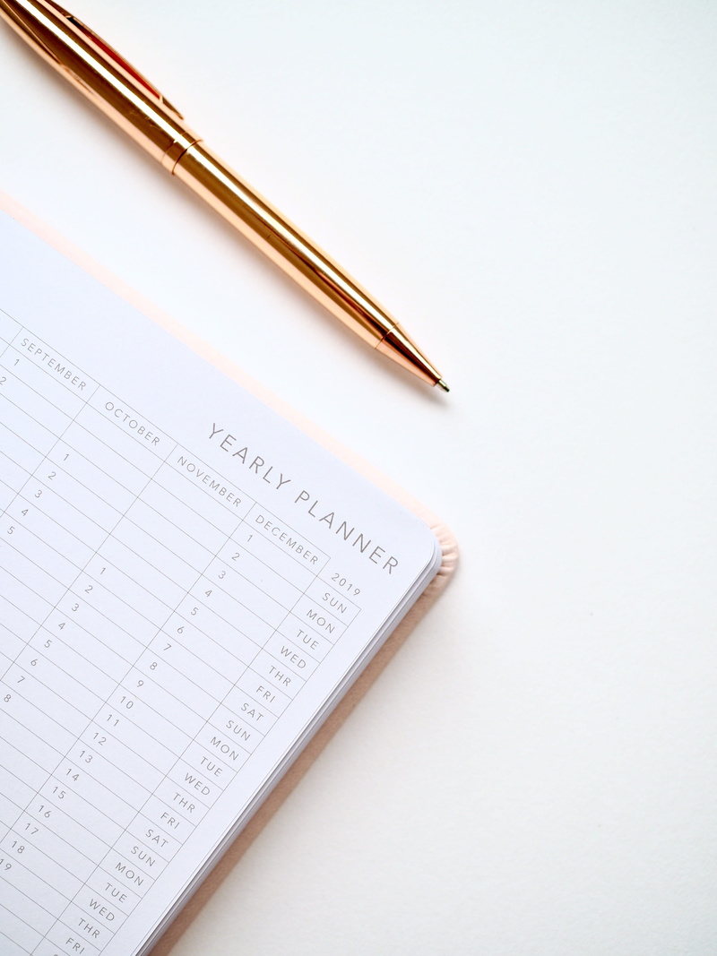 writing, planner, month, white color, handwriting, high angle view, notebook, cut out, planning, single object, pen, table, diary, writing instrument, black