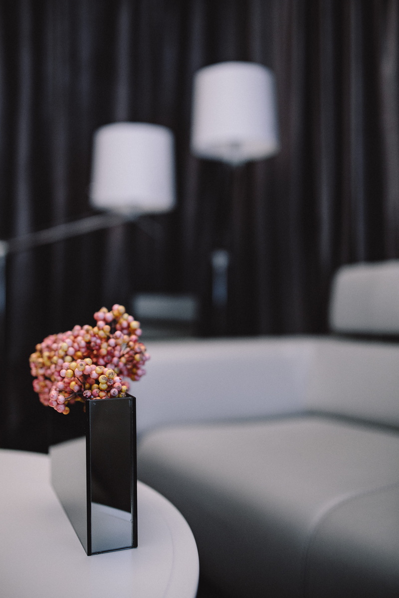 plant, minimalist, indoors, electric lamp, sofa, design, living room, cup, food and drink, wedding, focus on foreground, grey, hotel, still life, luxury
