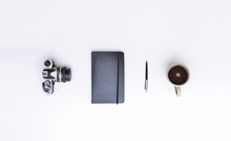 group of objects, metal, handbook, key, desk, white, mug, organized, dslr, objects, protection, close-up, technology, filled, pen, black, safety, no people