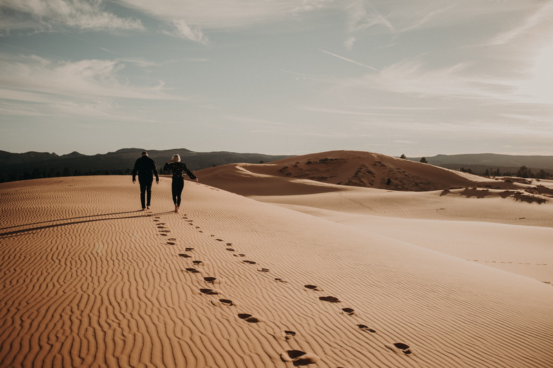 sand, desert, arid climate, outdoors, sky, men, person, tranquility, real people, couple - relationship, sand dune, two people, landscape, beauty in nature