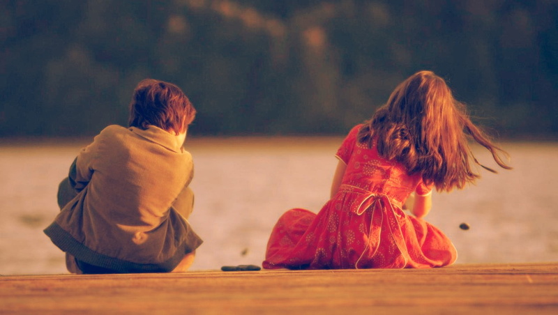 focus on foreground, human hair, dyed red hair, hairstyle, clothing, two people, land, hair, nature, dress, rear view, sitting, togetherness, offspring