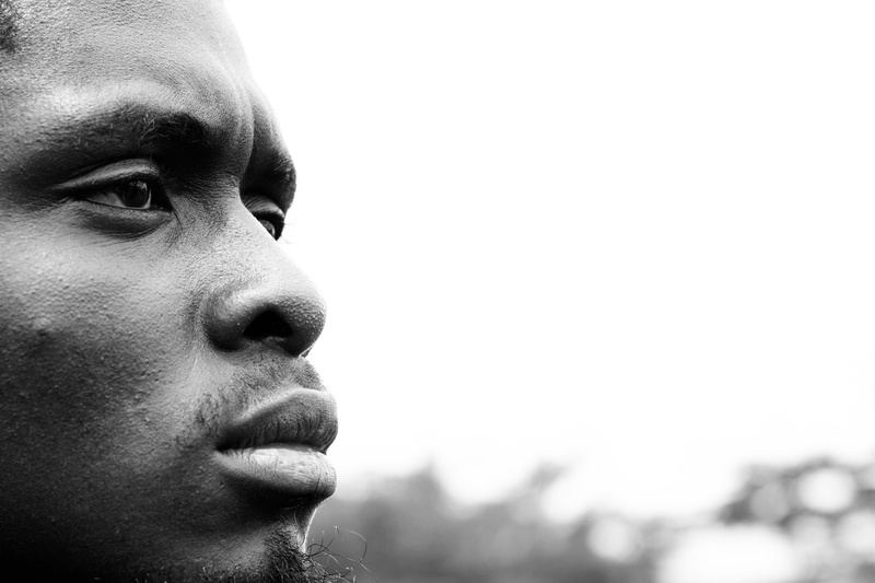 leisure activity, onlooking, body part, face, outdoors, frown, moustache, young men, copy space, nigeria, real people, profile view, looking, abuja, nigera
