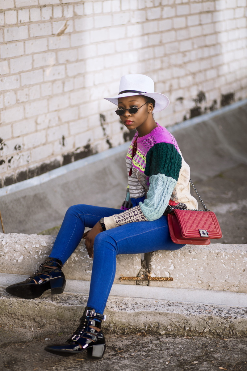 pants, person, sitting, style, one person, jeans, day, daylight, wear, females, skinny, nigerian, portrait, model, canal, wearing, black, wall, adult, full length
