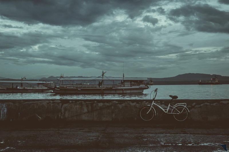 human, overcast, parking, sports, near, built structure, philippines, bike, outdoors, boat, machine, sky, cloud - sky, wheel, vehicle, bicycle, nature