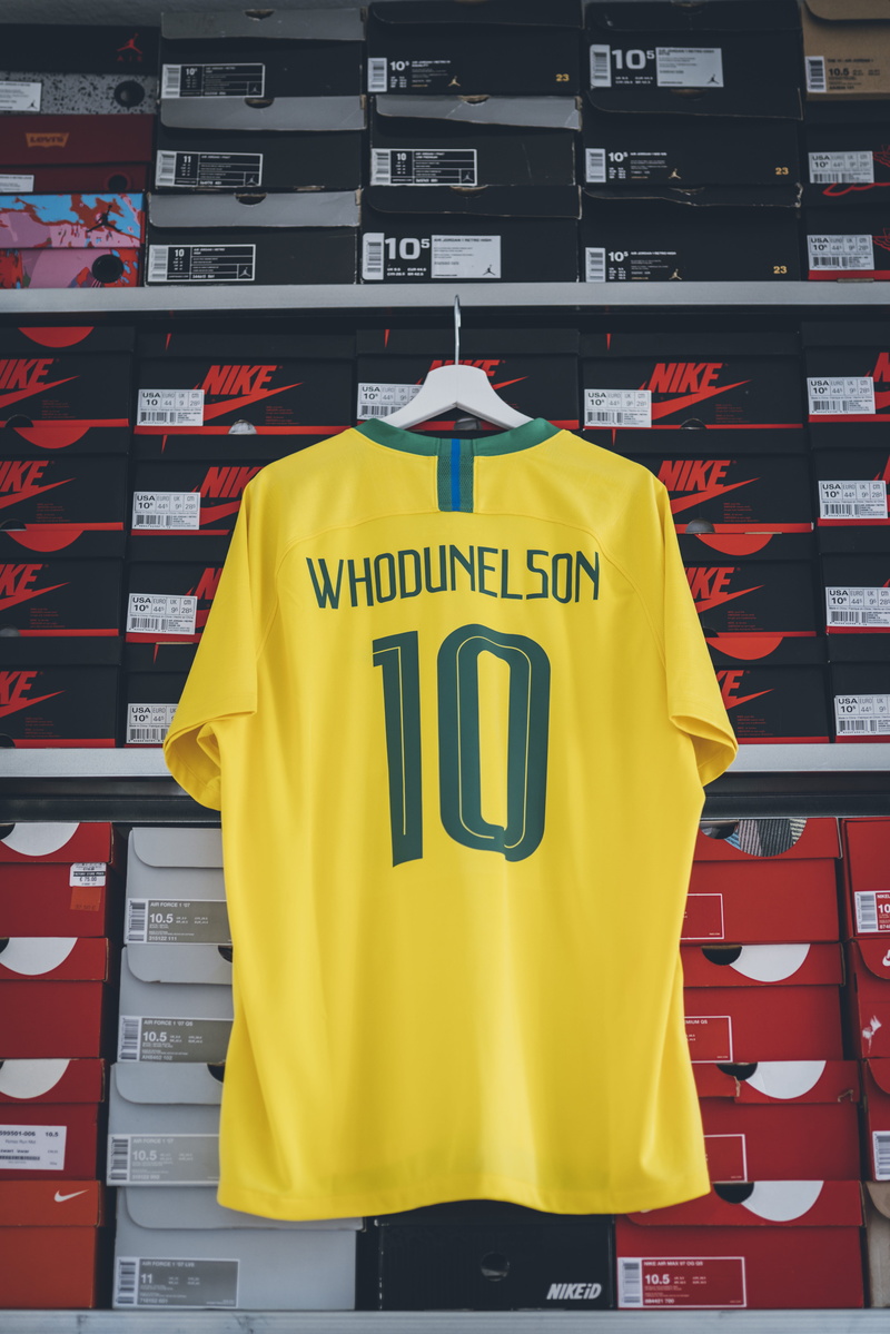 store, soccer, western script, nike, indoors, rack, day, human, jersey, lifestyle, no people, side by side, apparel, number, dressing room, football, script