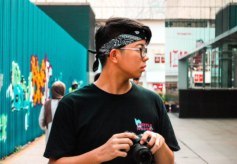 kuala lumpur, headband, human, electronics, murals, front view, left, city, people, lifestyles, camera, man, technology, young adult, undershirt, outdoors