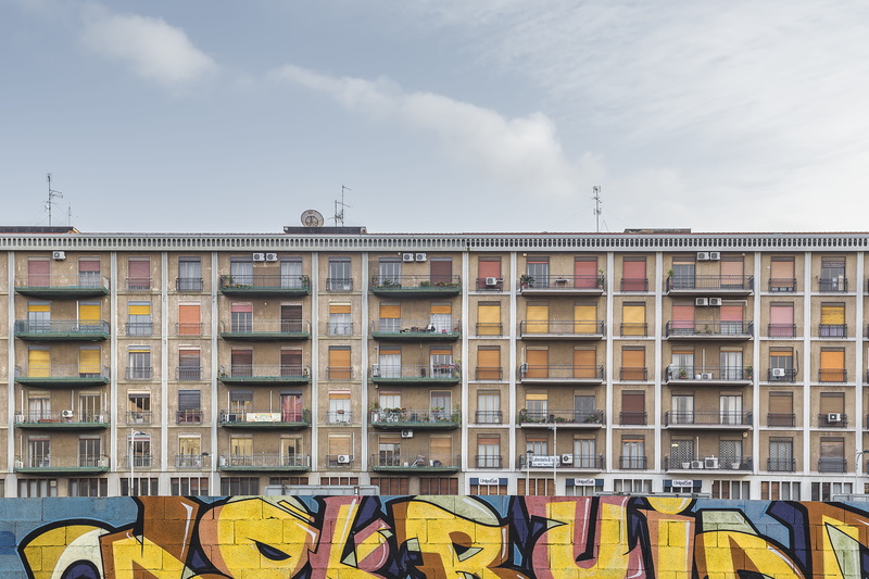low angle view, building, nature, side by side, painting, shipping container, cityscape, white, brown, cloud - sky, communication, day, mural, yellow, clothing