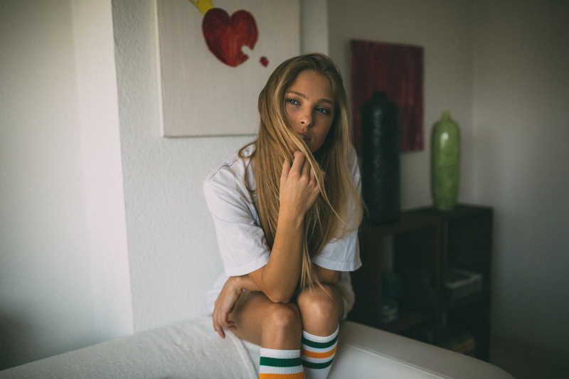 young adult, sadness, indoors, domestic room, T-shirt, long hair, model, sitting, young women, portrait, beautiful woman, one person, contemplation, hairstyle