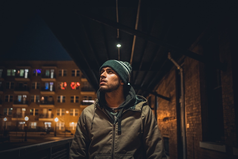 man, front view, cap, one person, united states, city, young men, outdoors, building, real people, looking, standing, clothing, lighting, beanie, lifestyles
