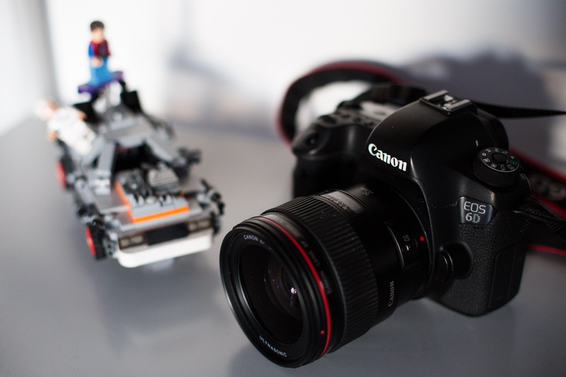 toy, person, modern, creativity, electronics, camera - photographic equipment, harness, occupation, star wars, lego, indoors, digital camera, industry