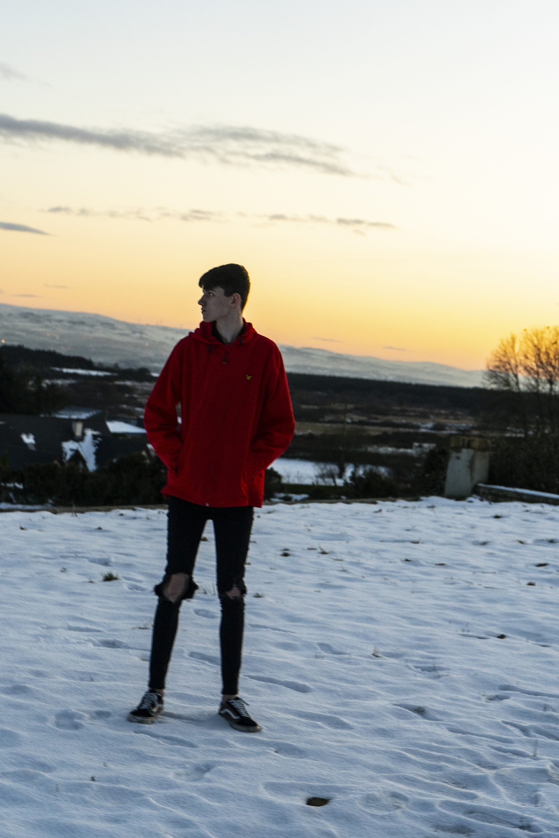 overcoat, raincoat, clothing, tree, beauty in nature, orange color, sweater, ski boot, boot, sleeve, standing, footwear, jacket, scenics - nature, cold temperature