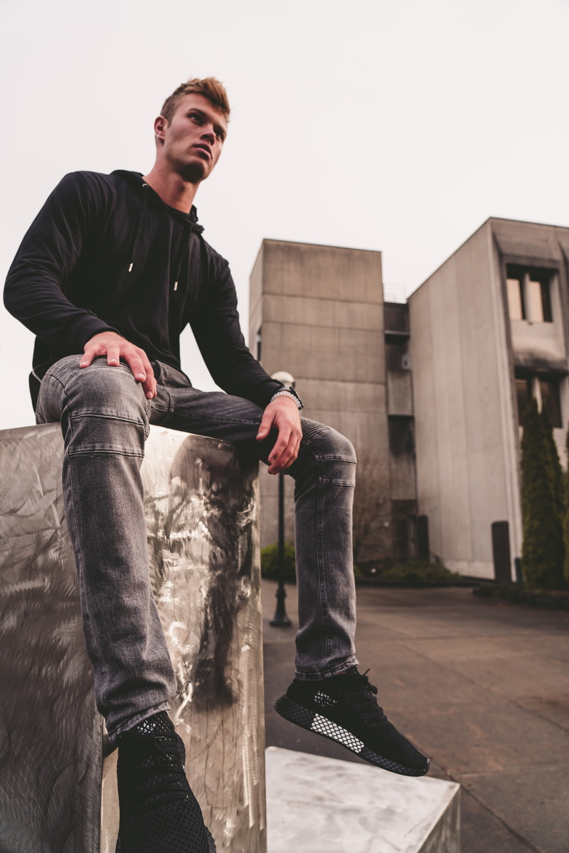 dark, teenager, person, architecture, built structure, yeezy, street style, street wear, footwear, lifestyles, day, young men, full length, one person