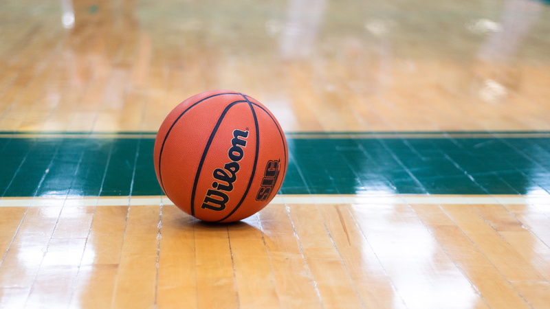 communication, basketball - sport, aluminium, table, focus on foreground, sports equipment, person, text, can, wood, deodorant, sports, people, indoors