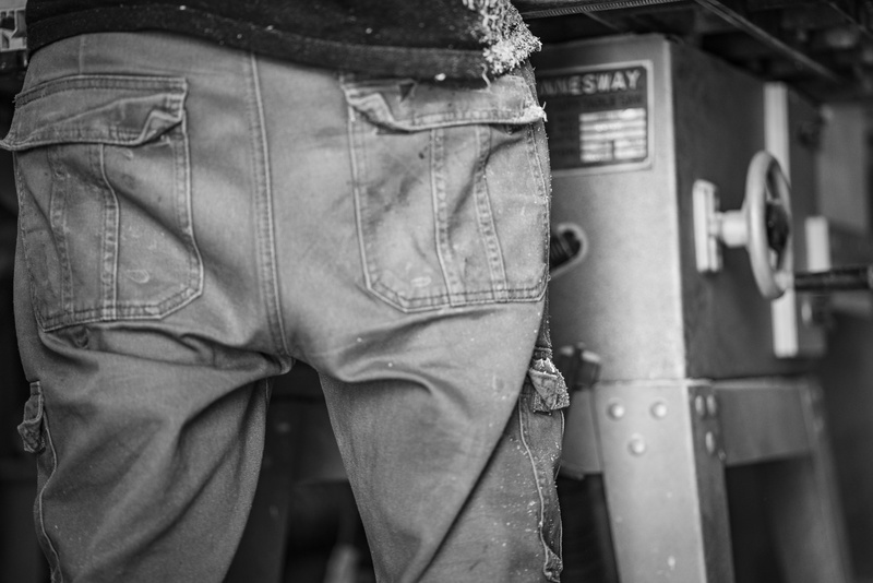 standing, bandw, real people, pents, rear view, jeans, clothing, one person, midsection, outdoors, machine, gear, day, adult, lifestyles, men, human body part