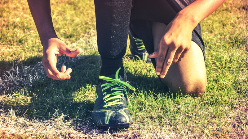 limb, human body part, adult, growth, field, grass, green color, shoes, human limb, active, person, football, low section, human foot, green, healthy lifestyle