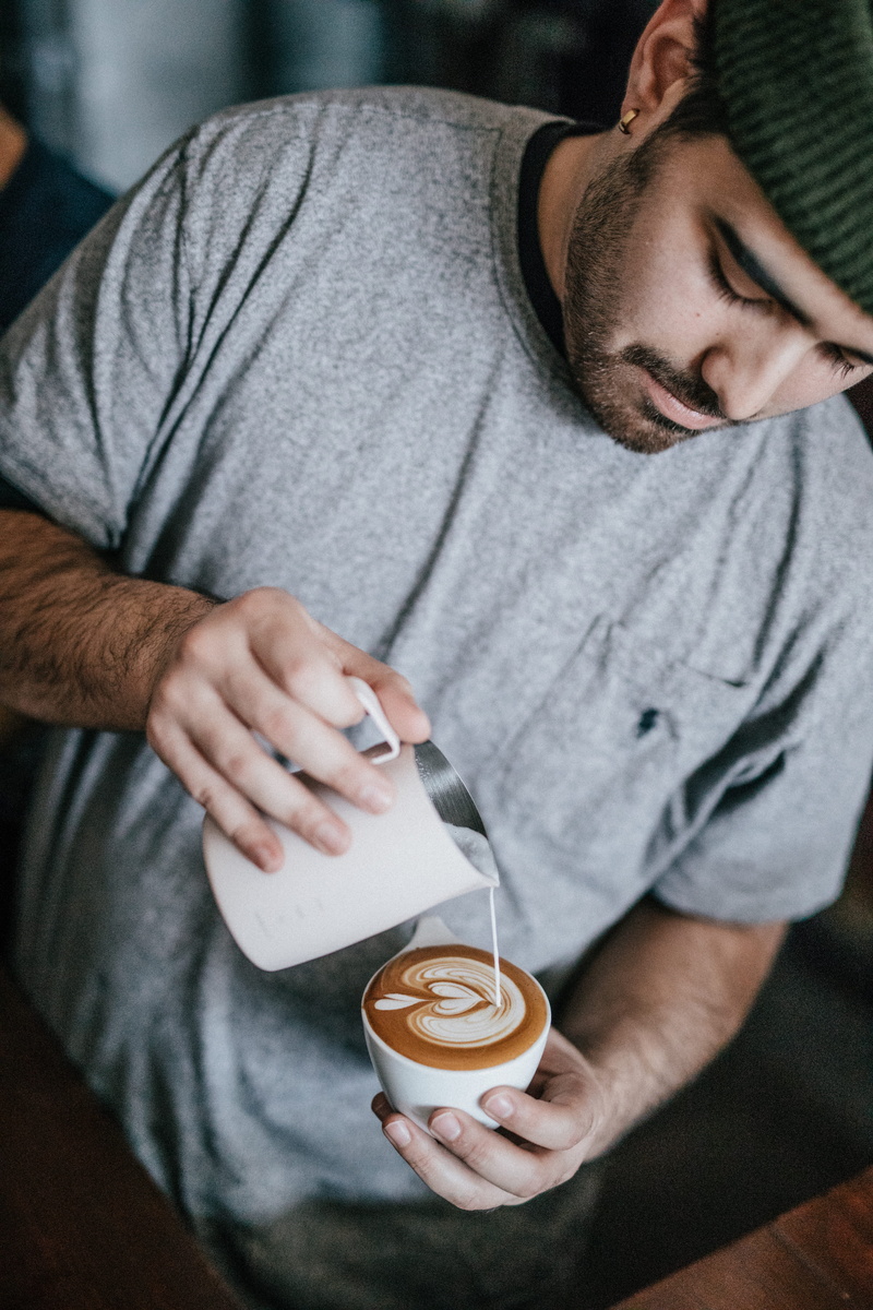 hot drink, cappuccino, shirt, food and drink, latte art, crew, casual clothing, coffee, gray, making, cup, coffee cup, grey, wearing, pouring, coffee bar