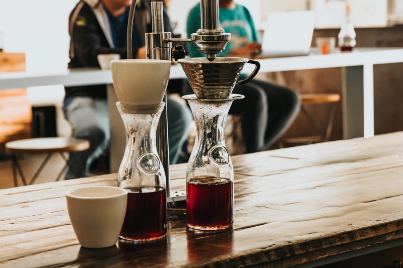 counter, glass, barista, clear, rbown, hurricane, cup, tray, 5K, close-up, two, red, still life, bottles, mug, bar counter, wooden, focus on foreground